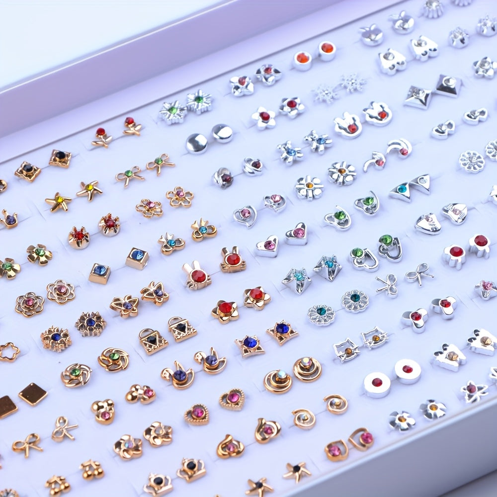 Display of assorted gold-tone and silver-tone stud earrings with rhinestone designs