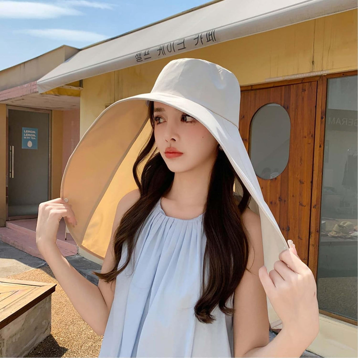 Sun hat shown from the side with neck flap down