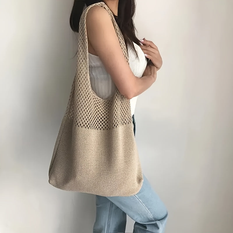 Cream tote worn over the shoulder