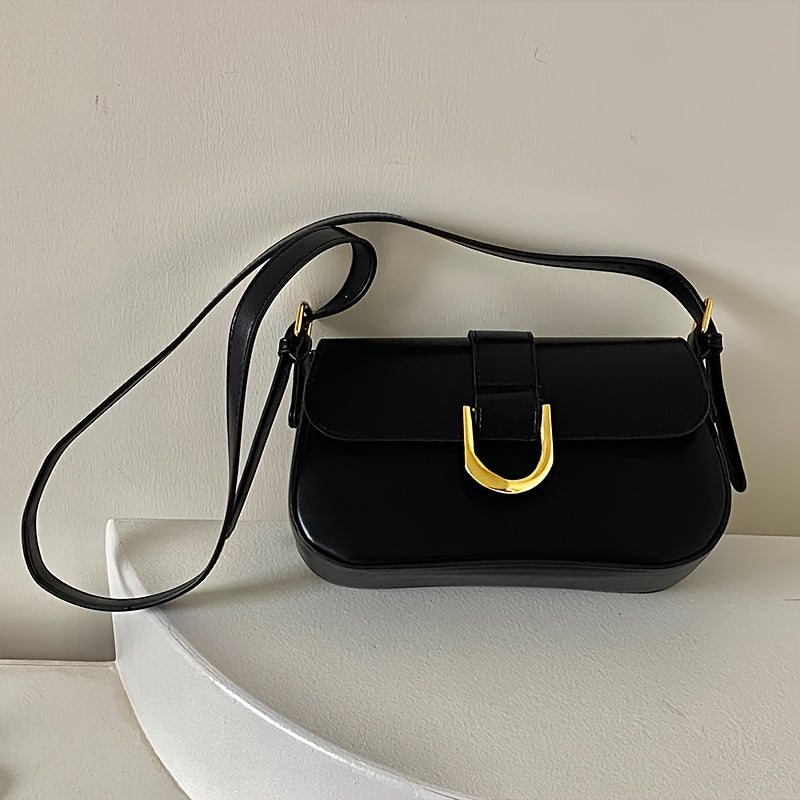 Black patent baguette shoulder bag with gold D-ring