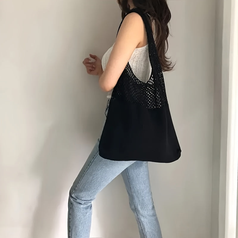 Black tote worn over the shoulder