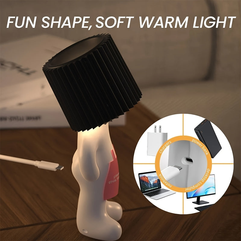 Lamp lit on a desk showing the soft warm light