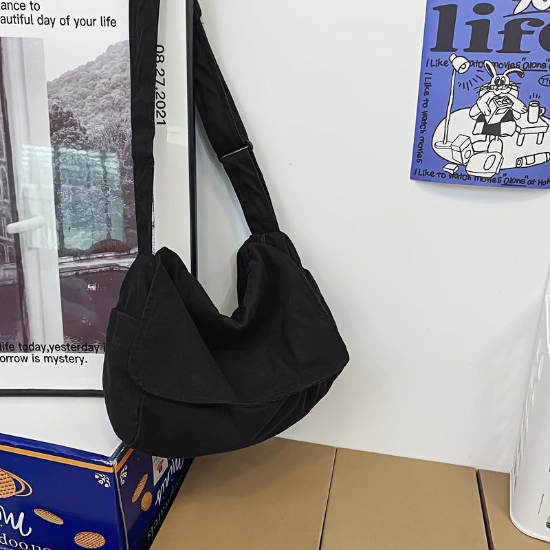 Black canvas bag hanging by the strap