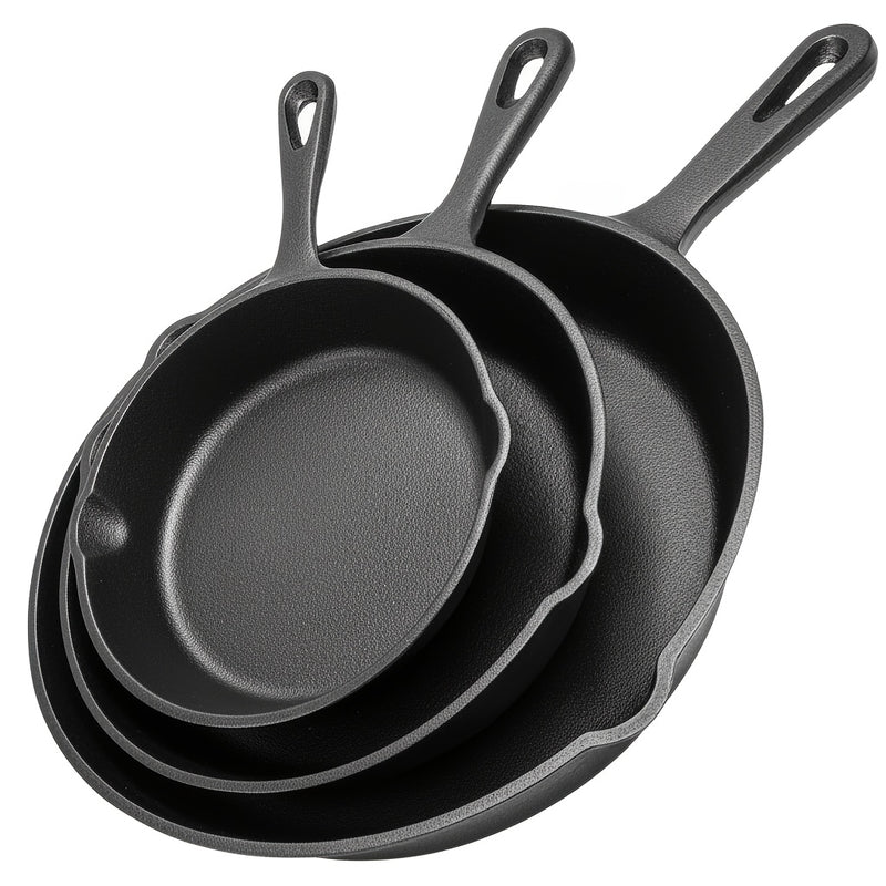 Three-piece cast iron skillet set in graduating sizes with drip spouts