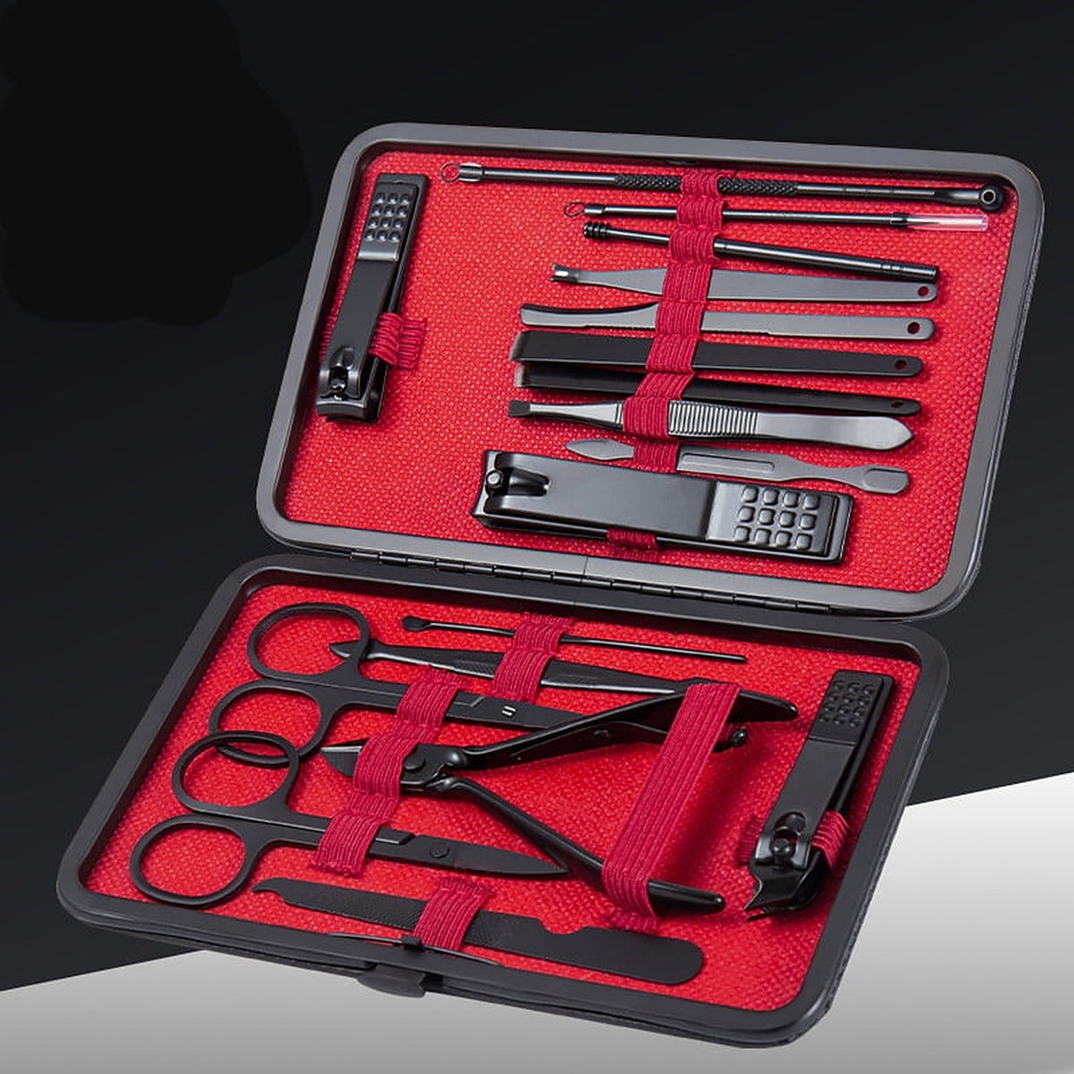 The case open flat showing black stainless tools held in red elastic loops against a red lining