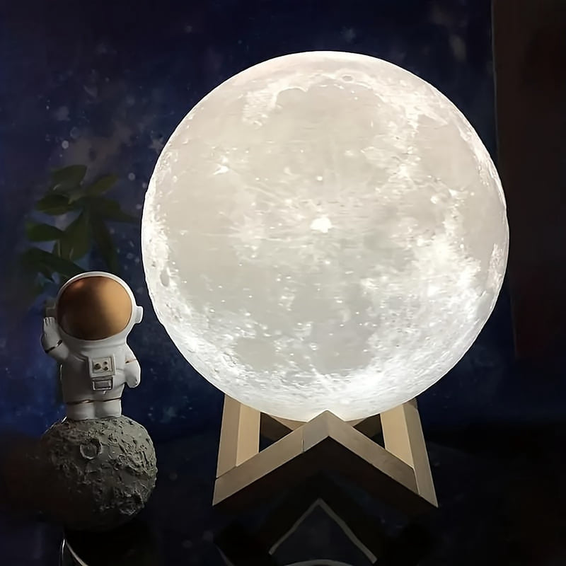 The lamp lit white on its stand beside a small astronaut figurine against a dark sky