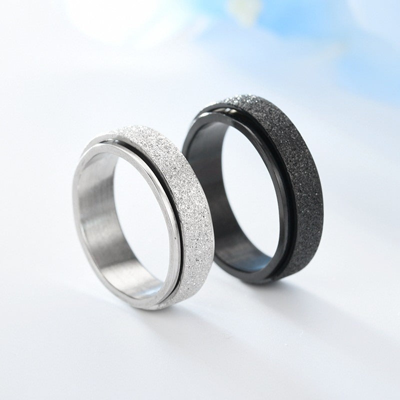 Silver and black rings side by side