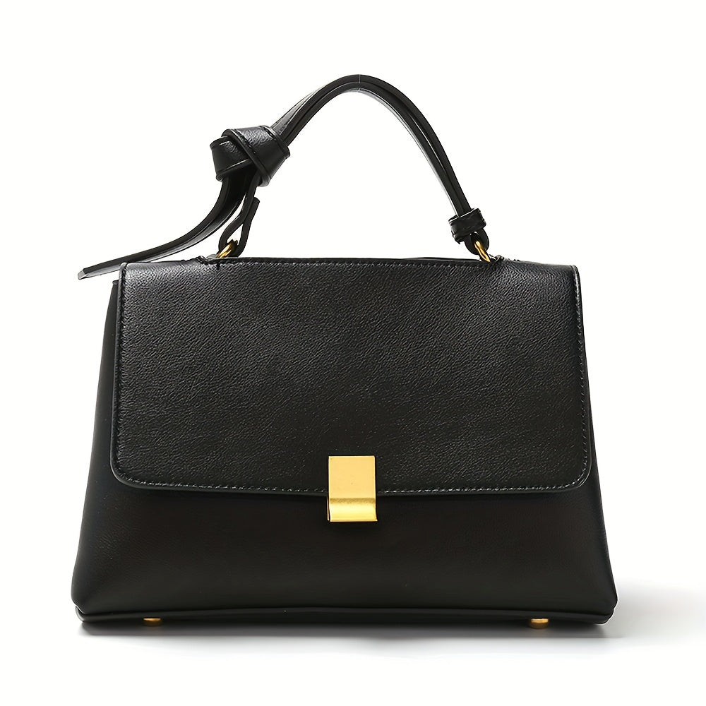 Black top handle flap handbag with gold clasp