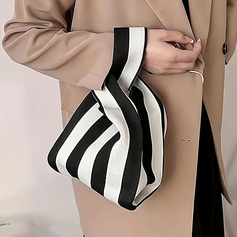 Knot tote carried in the hand