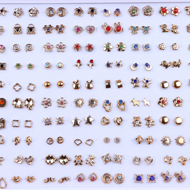 Assorted gold-tone stud earrings: hearts, flowers, stars, bows and rhinestone designs