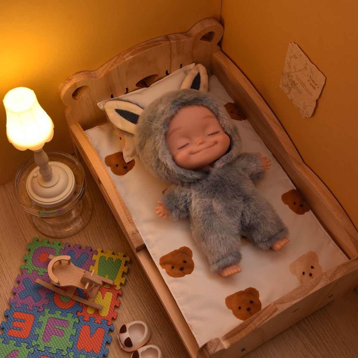 Eyes closed doll resting in a wooden toy bed