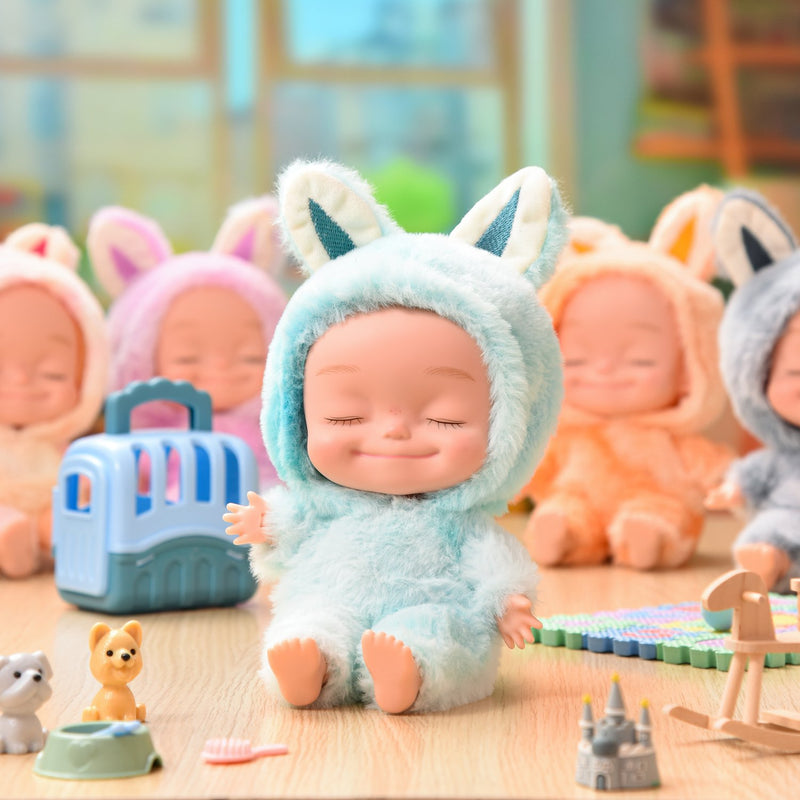 Eyes closed dolls in plush animal onesies, several styles together
