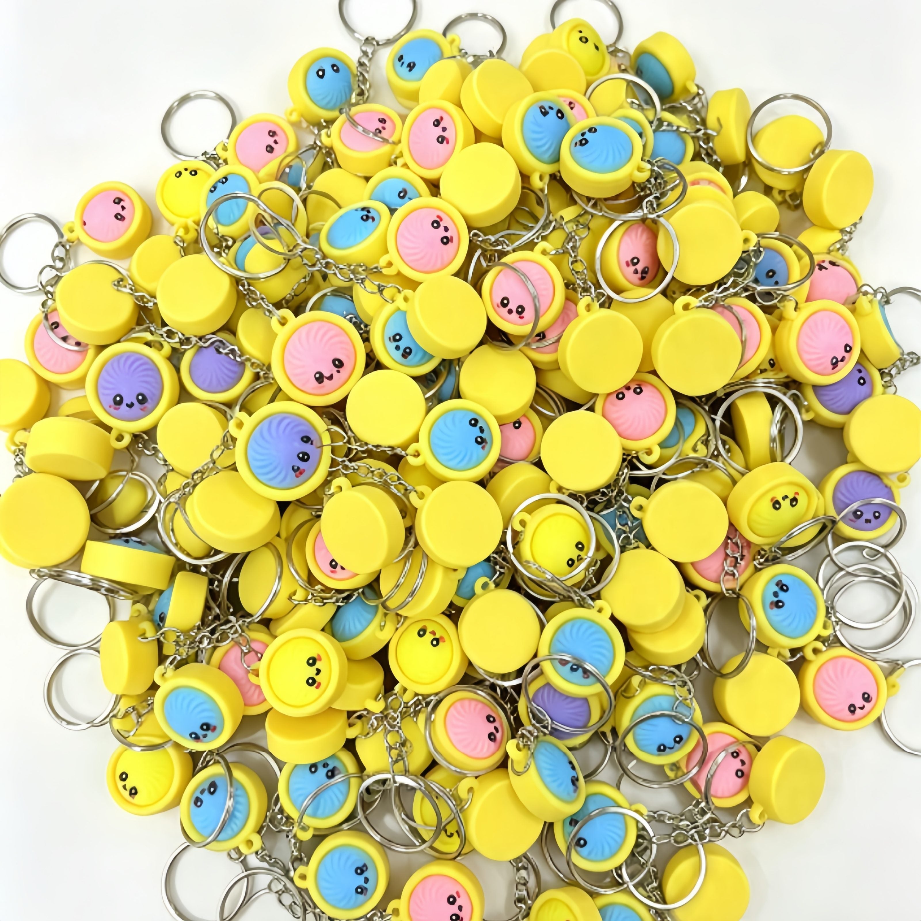 Assorted dumpling keychains showing the front faces and plain reverse side