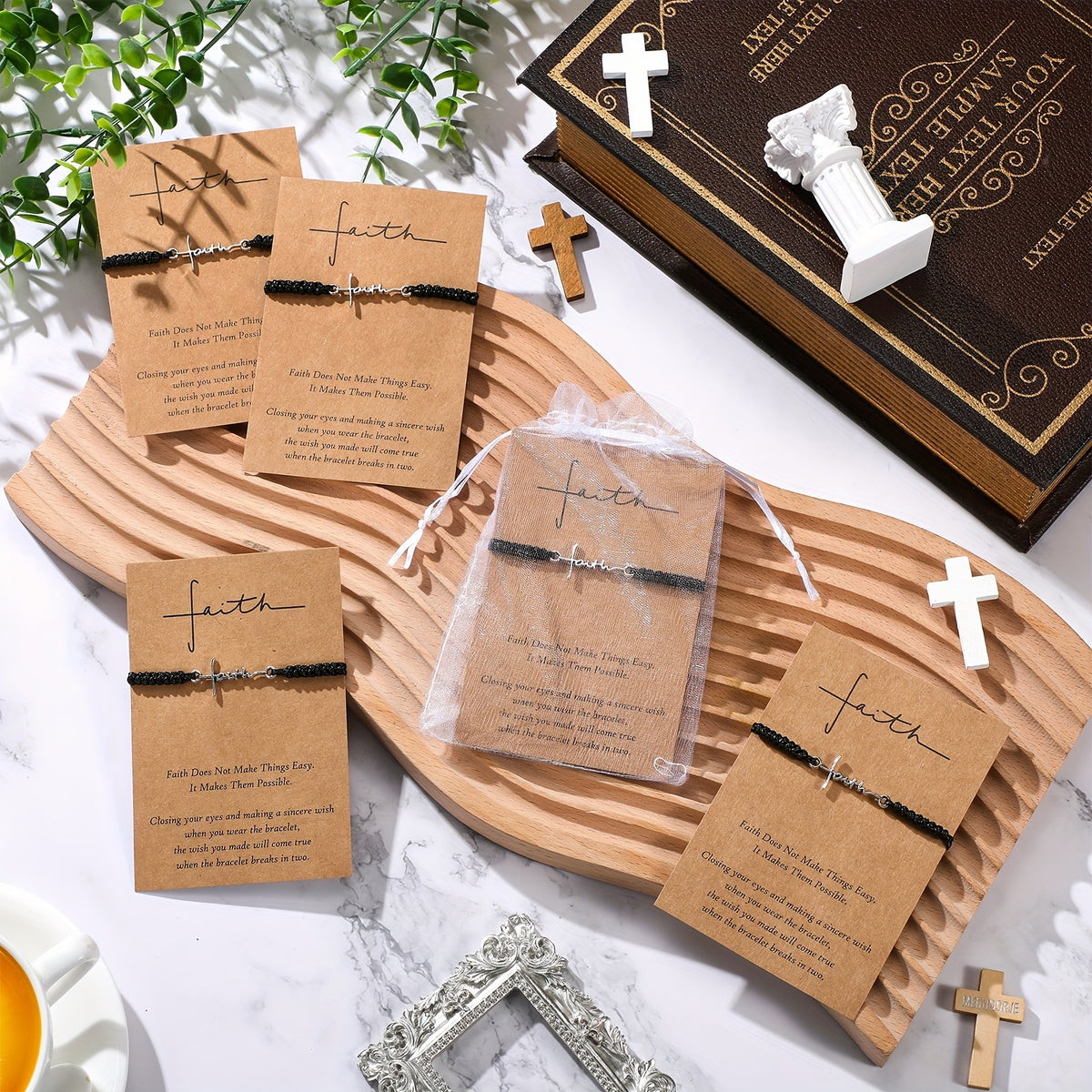 Faith cord bracelets on cards with an organza gift bag and a bible