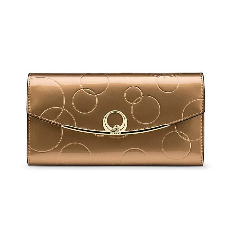 Gold patent long wallet with gold bar clasp and embossed circles