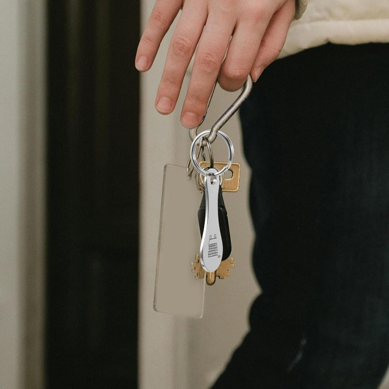 Shopping cart token keychain hanging with house keys