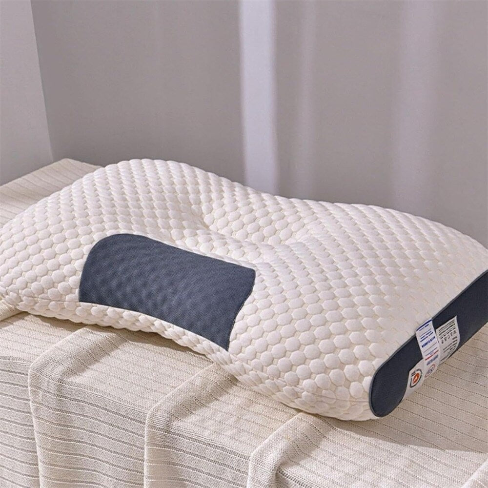 Knitted contour neck pillow on a made bed