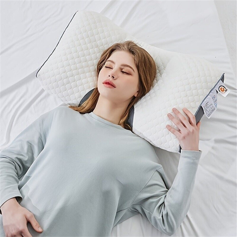 Contour neck pillow in use, head resting in the centre hollow