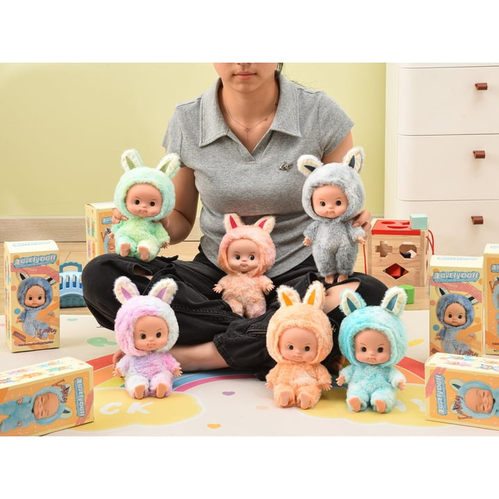 The full color range of dolls shown together with their retail gift boxes