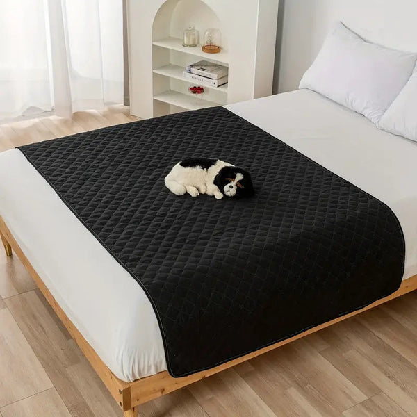 Waterproof Pet Bed Cover for Furniture in black, laid down over a queen size bed