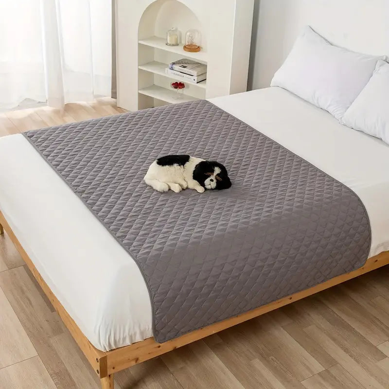 Waterproof Pet Bed Cover for Furniture in light gray, laid down over a queen size bed