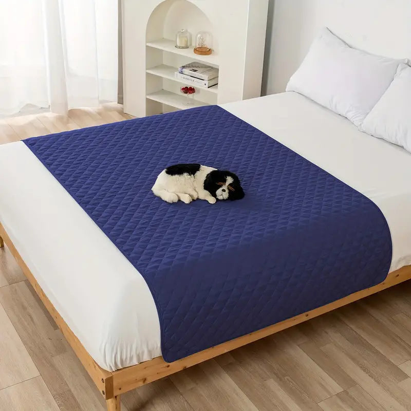 Waterproof Pet Bed Cover for Furniture in navy, laid down over a queen size bed