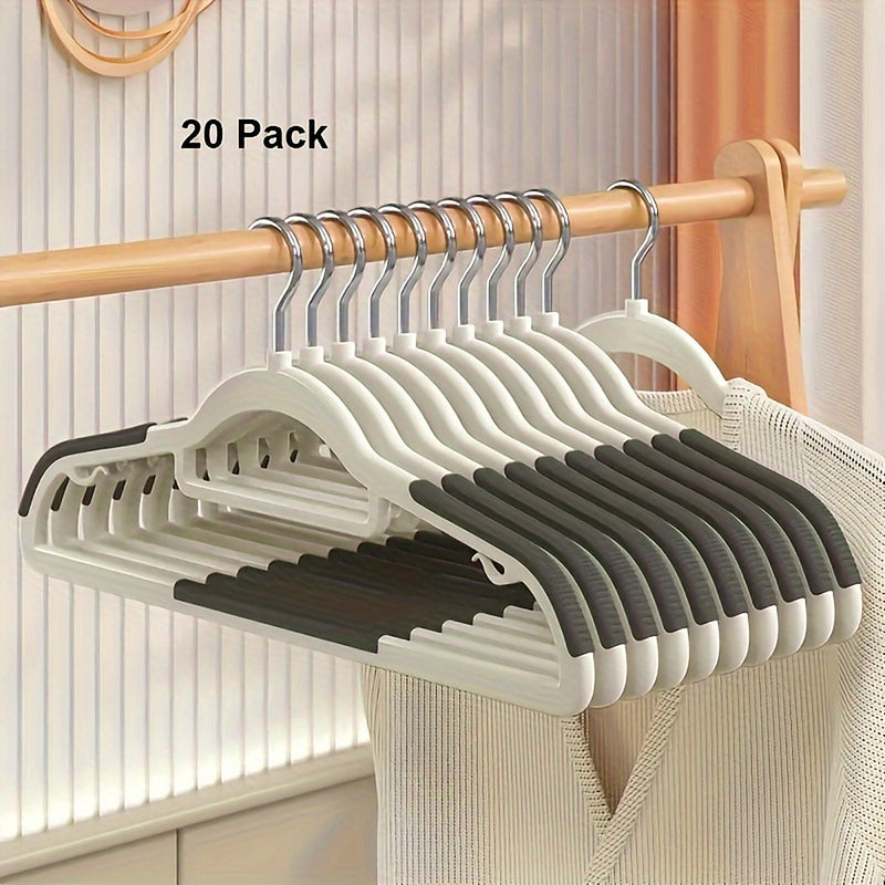 Twenty ivory hangers with dark gray ribbed shoulder grips on a closet rail, labeled 20 Pack