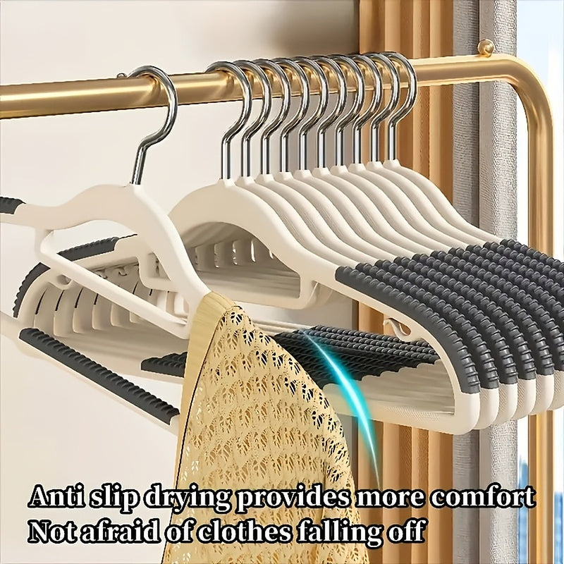 A knit top staying on the hanger, showing the anti-slip grip in use