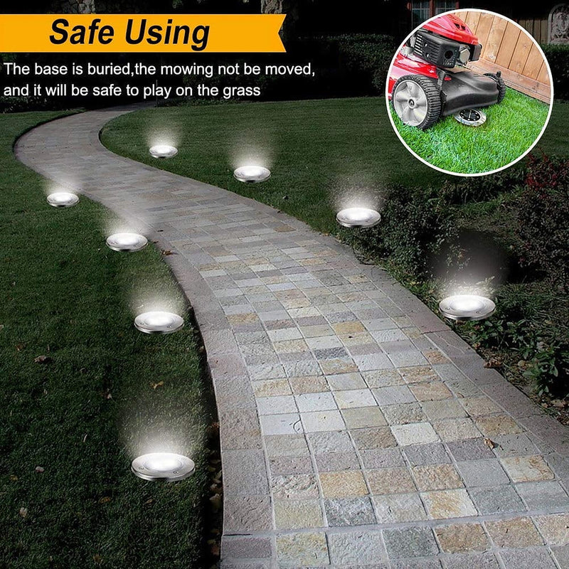 A line of the lights lining a curved garden path, safe to mow over