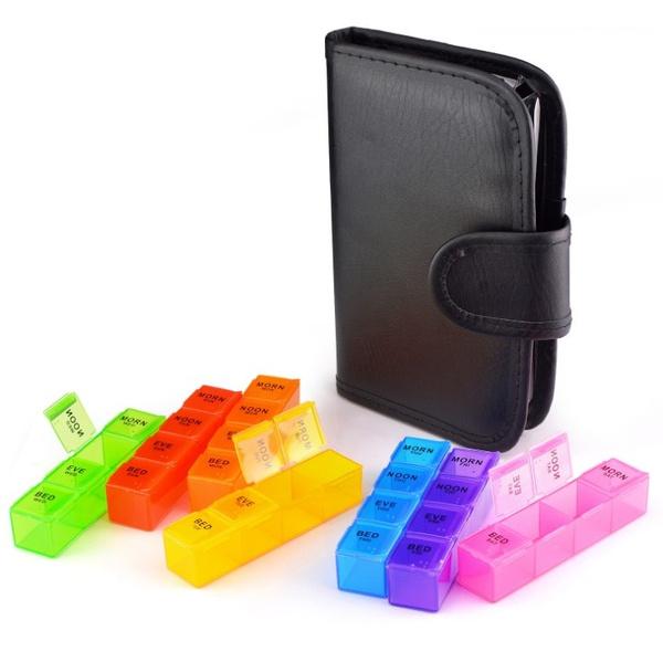 Closed case 7-Day Extra Large Pill Organizer with Cute Travel Case displayed with all pill cases spread out on a table
