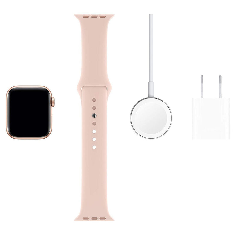 Apple Watch Series 5 laid out with charger and charger brick on rose gold background