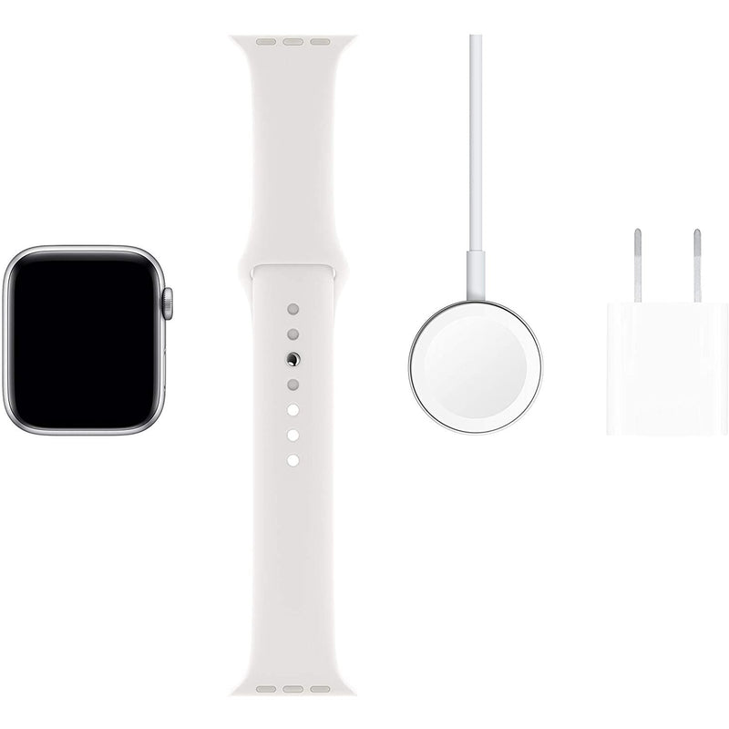 Apple Watch Series 5 laid out with charger and charger brick on white background
