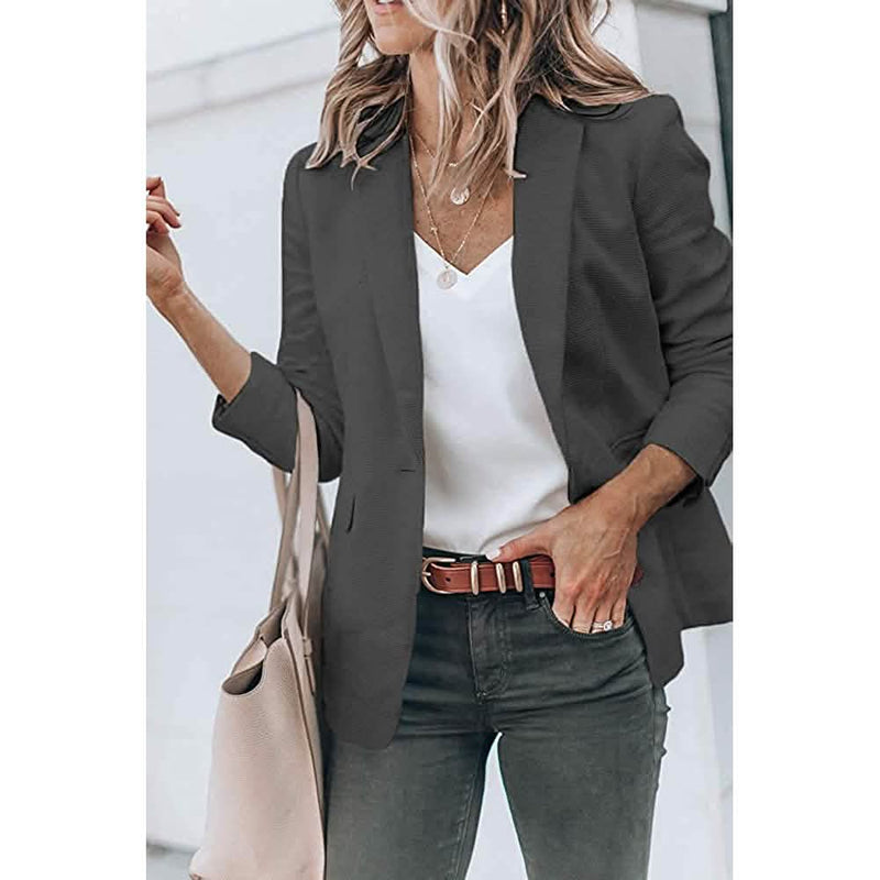Woman with a hand in her jeans' pocket wearing a Cicy Bell Womens Casual Blazer, shown in gray