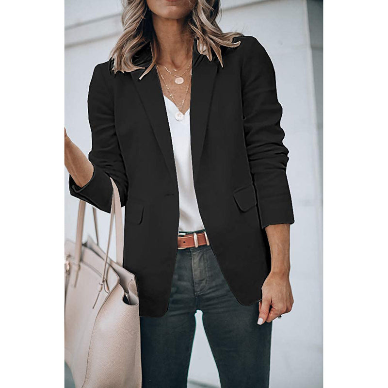 Woman standing on her side with a hand in the pocket wearing a Cicy Bell Womens Casual Blazer, shown in black