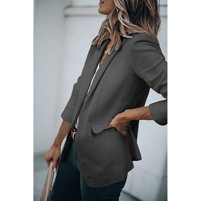 Woman standing on her side with a hand in the pocket wearing a Cicy Bell Womens Casual Blazer, shown in gray