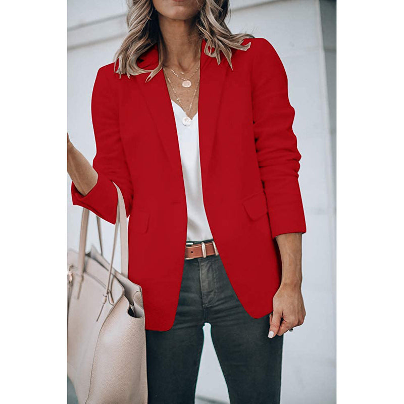 Woman holding her purse in the crook of her arm wearing a Cicy Bell Womens Casual Blazer, shown in red
