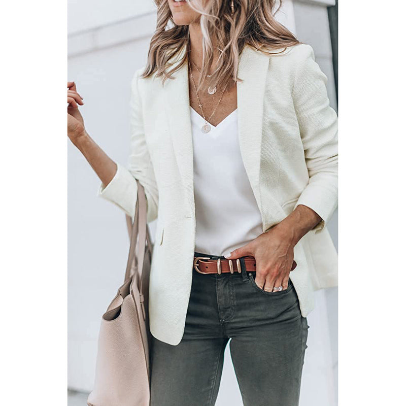 Woman with a hand in her jeans' pocket wearing a Cicy Bell Womens Casual Blazer, shown in white