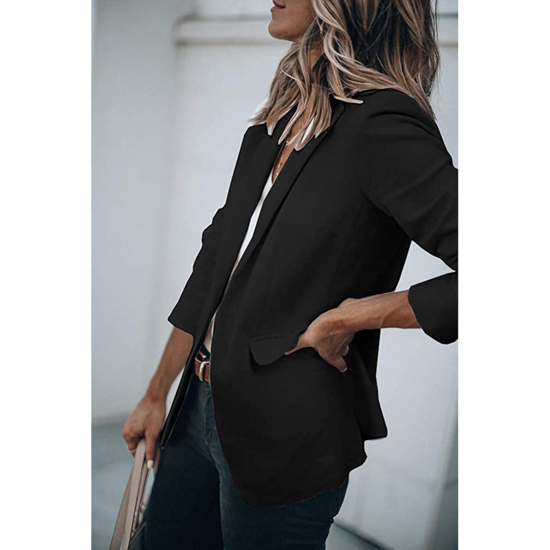 Woman with a hand in her jeans' pocket wearing a Cicy Bell Womens Casual Blazer, shown in black