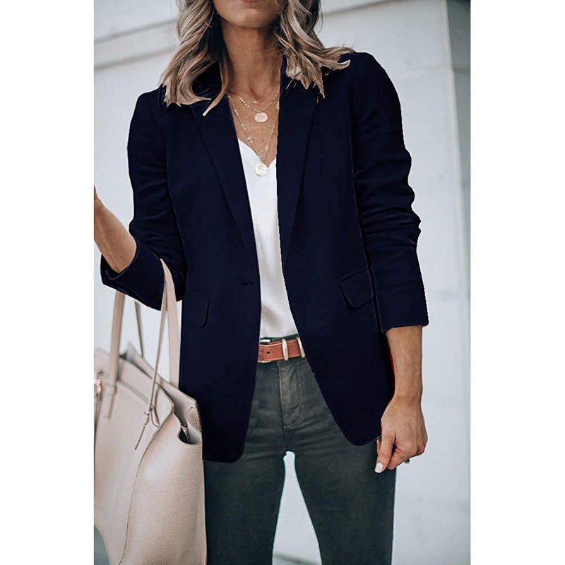 Woman holding her purse in the crook of her arm wearing a Cicy Bell Womens Casual Blazer, shown in navy
