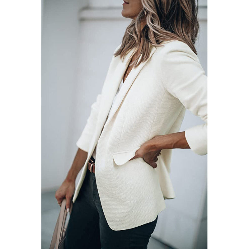 Woman standing on her side with a hand in the pocket wearing a Cicy Bell Womens Casual Blazer, shown in white