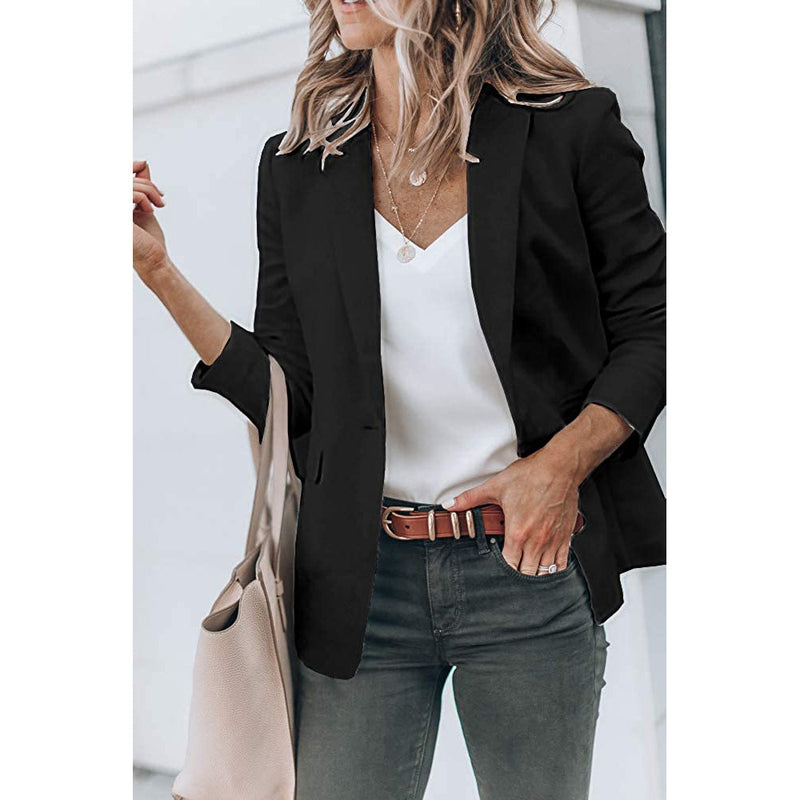 Woman holding her purse in the crook of her arm wearing a Cicy Bell Womens Casual Blazer, shown in black
