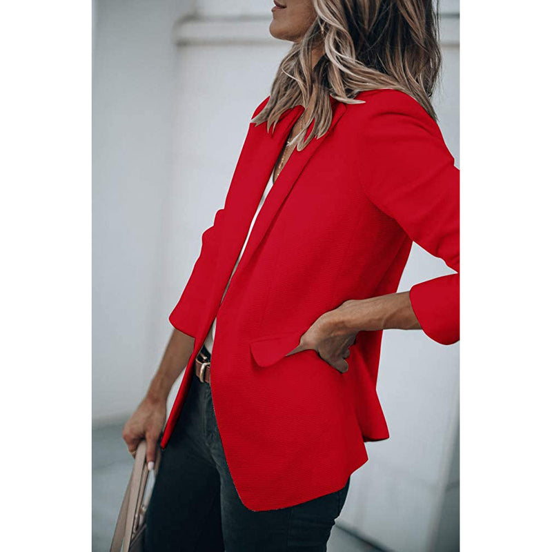 Woman standing on her side with a hand in the pocket wearing a Cicy Bell Womens Casual Blazer, shown in red