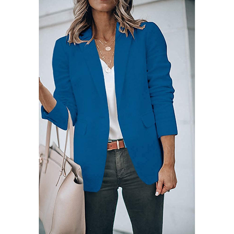 Woman holding her purse in the crook of her arm wearing a Cicy Bell Womens Casual Blazer, shown in royal blue