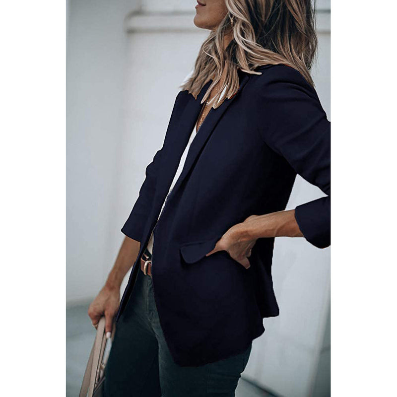 Woman standing on her side with a hand in the pocket wearing a Cicy Bell Womens Casual Blazer, shown in navy