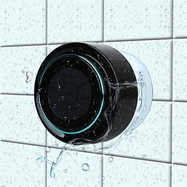 HAISSKY Portable Wireless Waterproof Speaker with FM Radio & Suction Cup shown attached to tiled bathroom wall