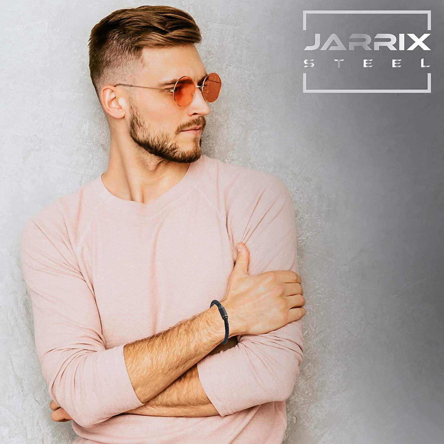 Cross-armed man wearing a Jarrix Steel Men's Bracelet Leather Stainless Steel Magnetic Closure