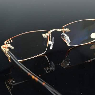 Luxury Men Diamond Glasses resting on a reflecting table in +3.5 prescription