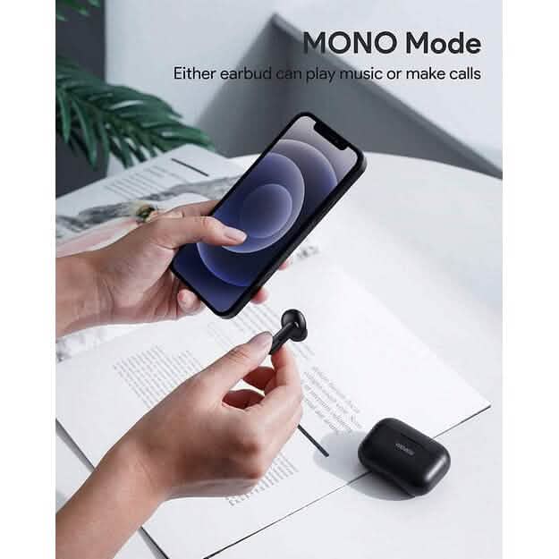 Person holding a smartphone with one hand and an LY-E1 True Wireless Earbud with the other hand