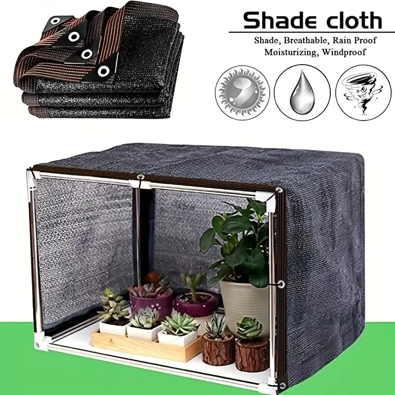Shade Cloth Outdoor Sun Shade With Grommets set up on a surface shown with several plants inside
