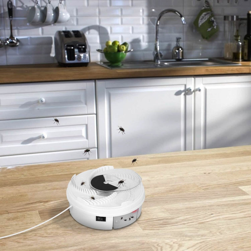 USB powered Electric Fly Trap Automatic Flycatcher in action placed on kitchen island with flies flying around it